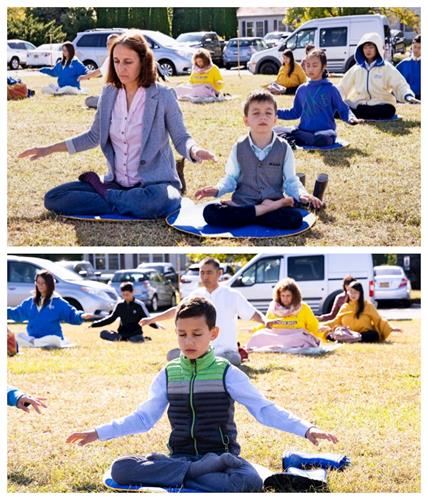 '图5：来自德国的法轮功学员朱丽亚（Julia Baniasadi）与二个儿子一起参加大炼功。'