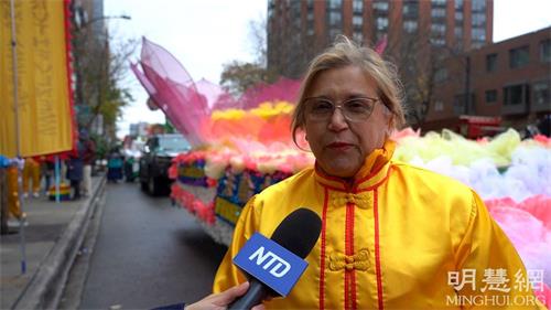 '图13：法轮功学员丽萨·卢德克希望更多人了解法轮功'